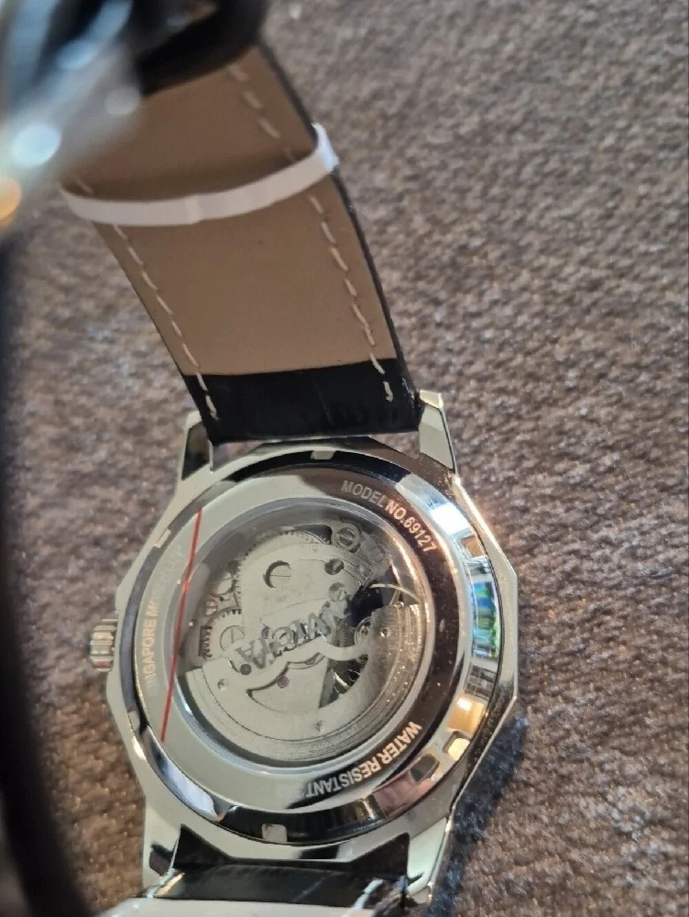Invicta Silver Skeleton Dial Watch with Blue Hands